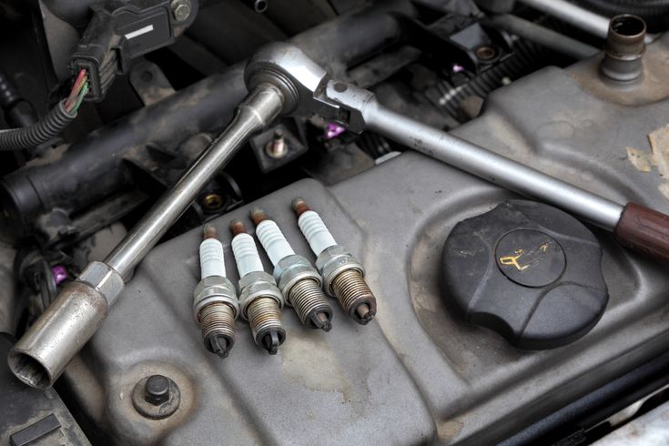 The Spark Plug Symptoms That Explain Why Your Car Hesitates When Accelerating