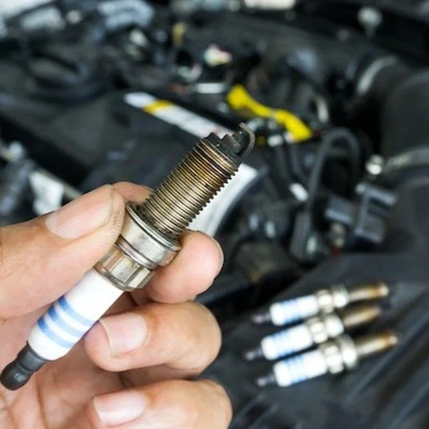 The Spark Plug Symptoms That Explain Why Your Car Hesitates When Accelerating