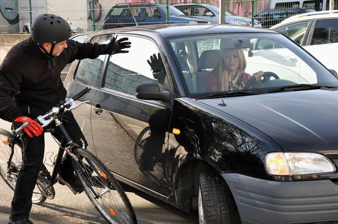 Who is at Fault When a Car Turns Right and a Bike Goes Straight on a Sidewalk?